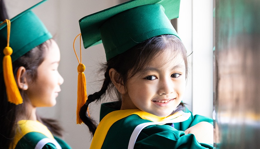 Child celebrating graduation